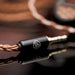 64audio solo cable end close up on brown table