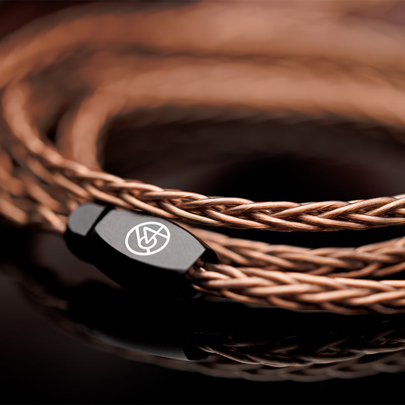 64 audio solo cable coiled up on brown surface