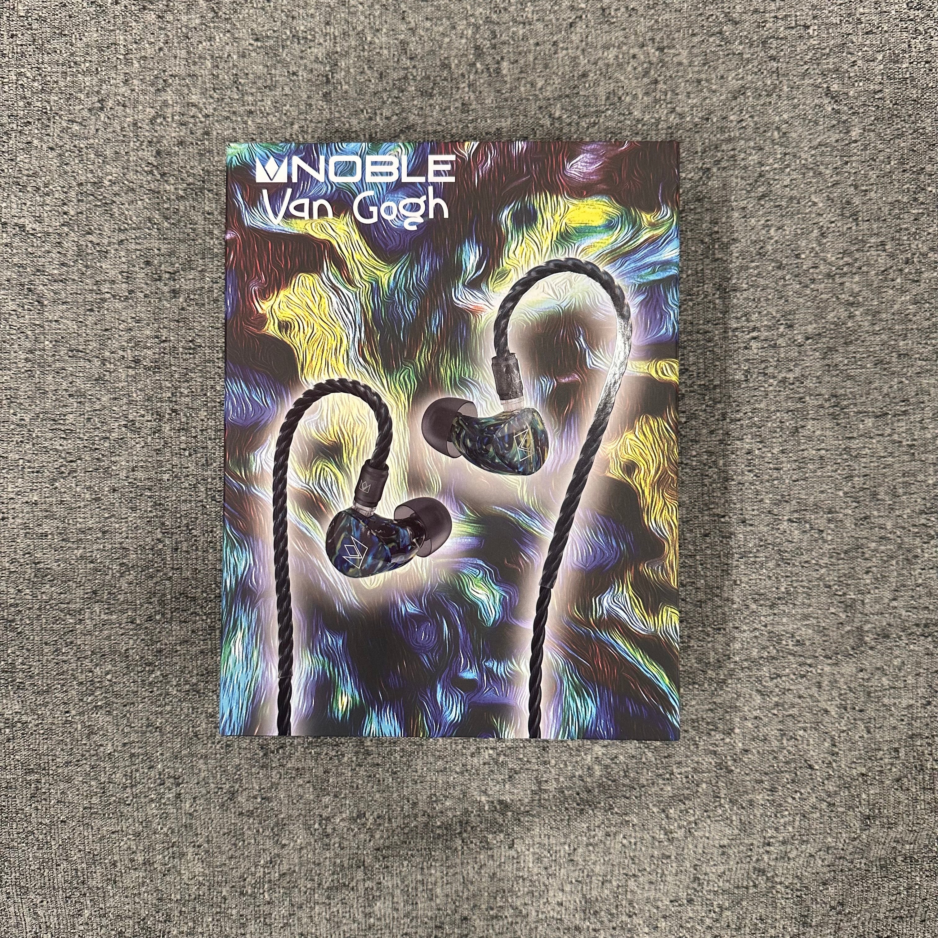 Noble Van Gogh earphone packaging on a textured surface