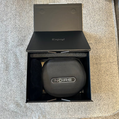 Black case with 'Noire' branding inside an open black box labeled 'Enjoyl'.