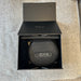 Black case with 'Noire' branding inside an open black box labeled 'Enjoyl'.