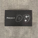 Black card with white text and graphics on a textured gray surface