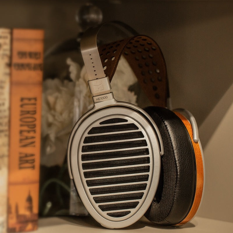 hifiman he1000 stealth headphone on a bookshelf