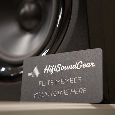 membership card leaning on a speaker and on a white table