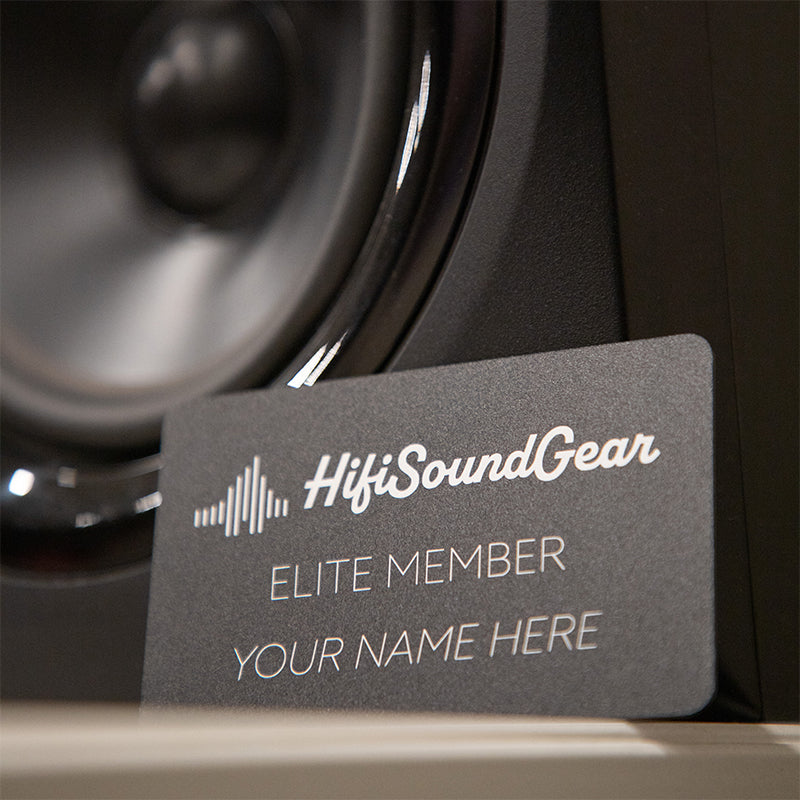 membership card leaning on a speaker and on a white table