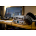 ifi audio pro ican studio headphone amplifier on a pc desk with headphones