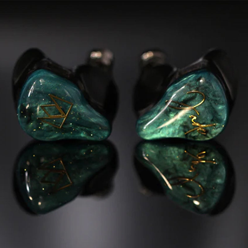 noble jade in ear monitors flat on surface with black background