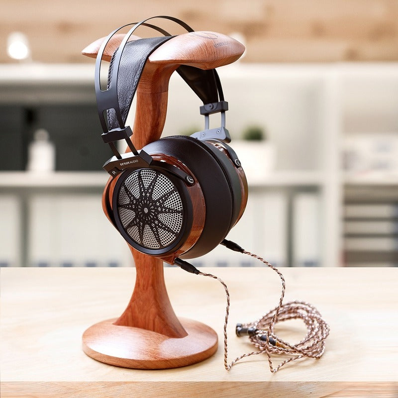 sendy audio apollo headphone on a wooden stand